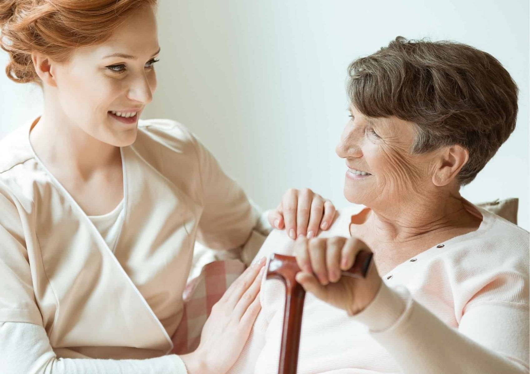 Elderly woman with cane