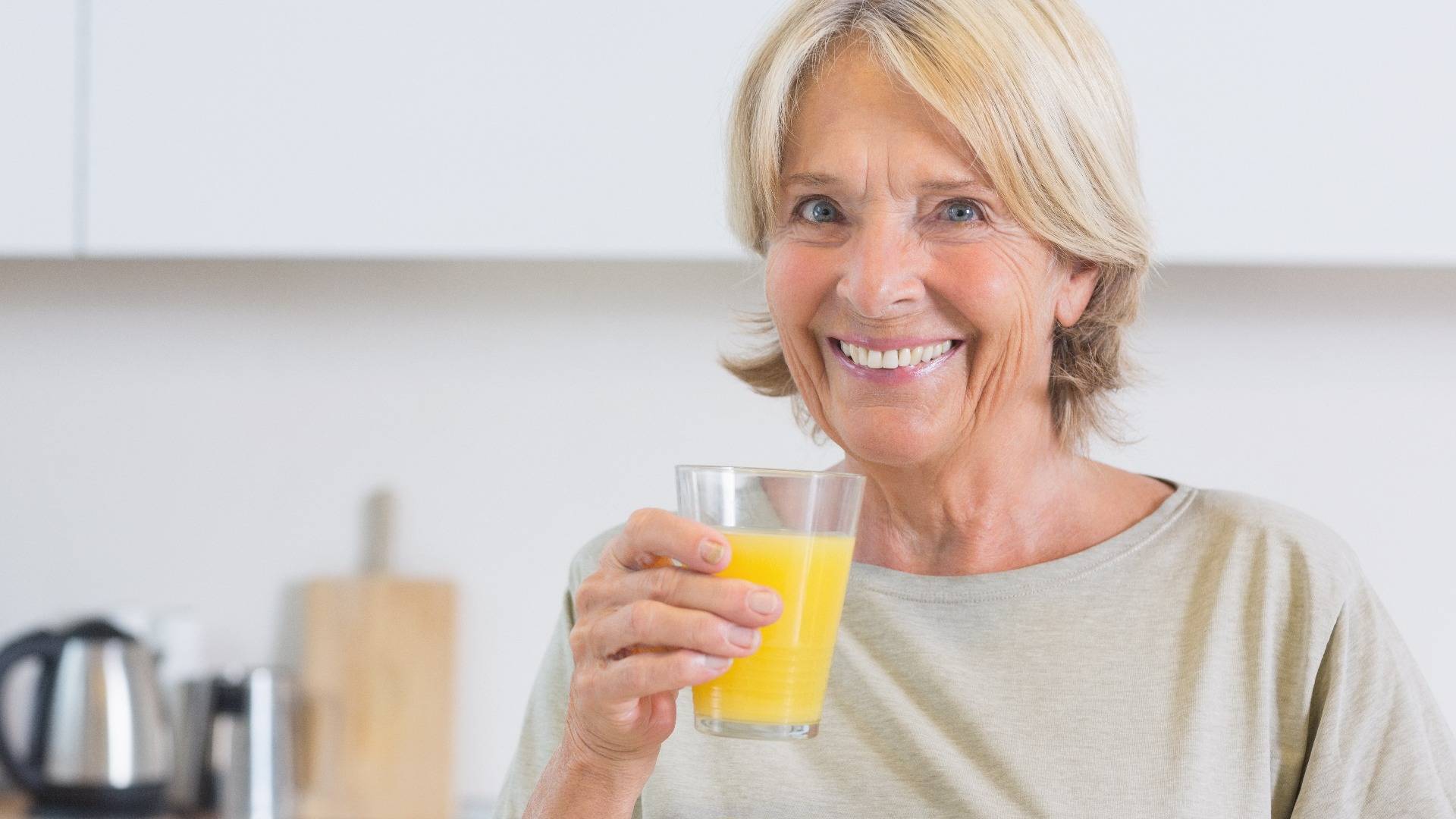 Woman drinking orange juice